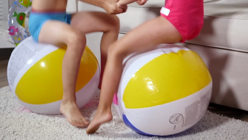Video Stok boy girl jumping on inflatable balls (100% Tanpa Royalti) 313763...