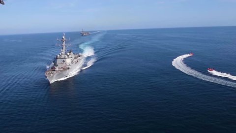 CIRCA 2010s - Aerials over a U.S. carrier strike group at sea.