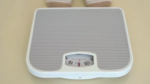 Person checking the weight on the scale    