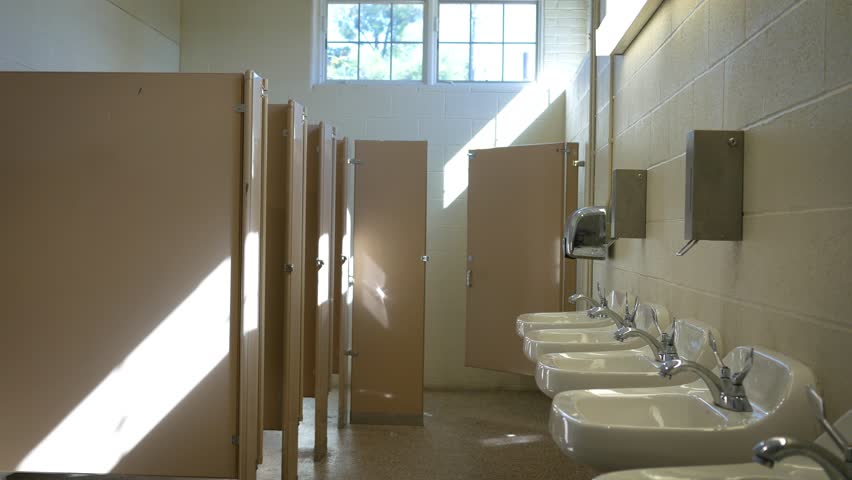 Establishing interior shot of empty public bathroom in the afternoon - ALT Royalty-Free Stock Footage #31381651