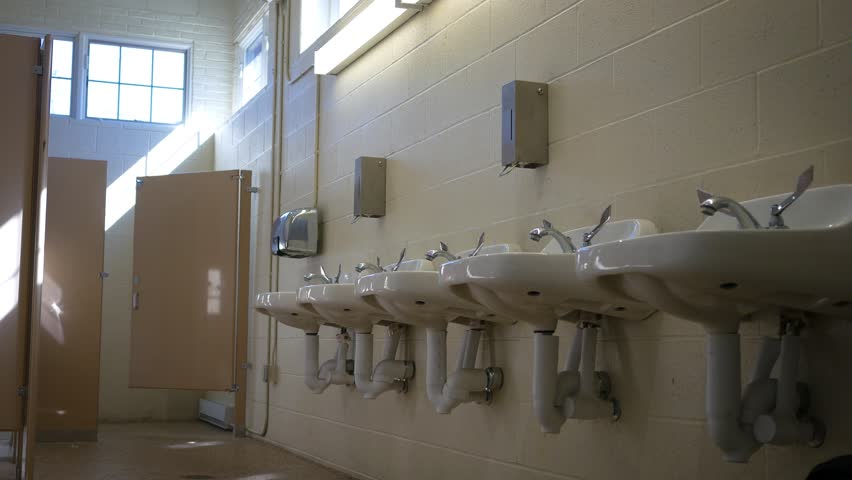 Establishing interior shot of empty public bathroom in the afternoon  Royalty-Free Stock Footage #31381693