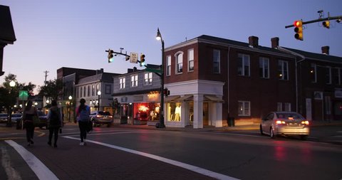 A dusk establishing shot of businesses on a typical Main Street in America. Pittsburgh suburb.  Day/Night matching available. Winter version available. Day ID: 20833027