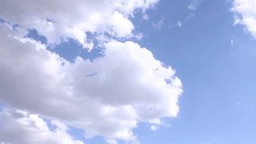 Rolling clouds with clear blue sky, nature building cloudy motion with clean skies,blue nice sky in good weather.Time lapse clip of white fluffy clouds over blue sky, Cloudsscape running across. FHD.