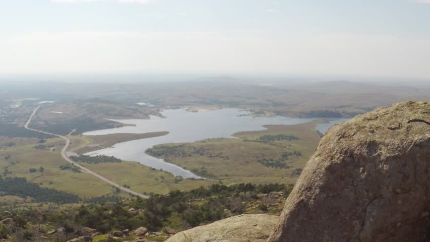 Wichita Mountains  Wildlife Refuge. Oklahoma, USA - September, 2017. POV. Point aerial view of beautiful landscape with lake, forest, road.