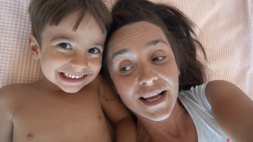 4K Selfie mother telling exciting story to her son, continuation of 4 years selfies
 | Shutterstock HD Video #31420924