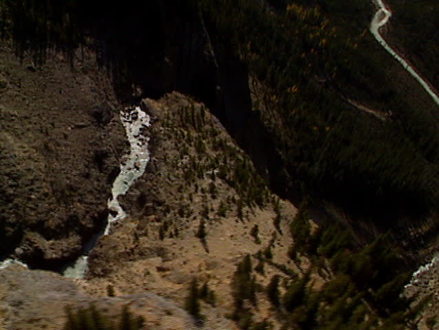 Fly over top and circle round Takkakaw Waterfalls in Yoho National Park Canada