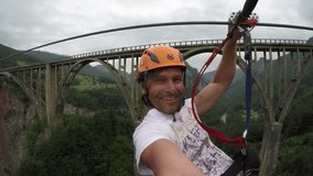 Man and woman having fun moving on zip-line, gopro shot - Powered by Shutterstock - Get 15% off with code: PIKWIZARD15