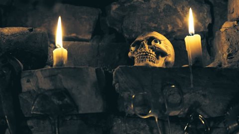 scary skull in place for rituals with instruments and candles