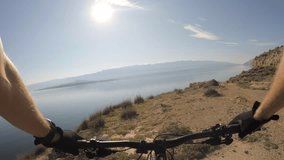 Man riding enduro mountain bike on rocky trail. View from first person perspective POV. Gimbal stabilized video. Shot with GOPRO HERO4 4K.