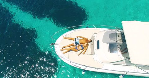 Aerial view of amazing island beach of couple on yacht