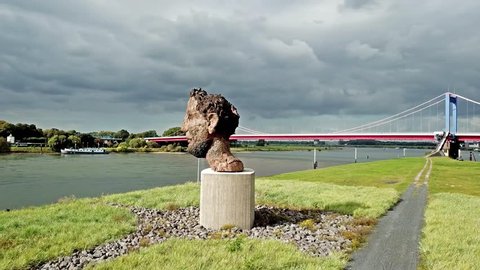 DUISBURG / GERMANY - OCTOBER 03 2017 : The sculpture Echo of the Poseidon created by Markus Lueppertz is greeting all mariners on the mercator island