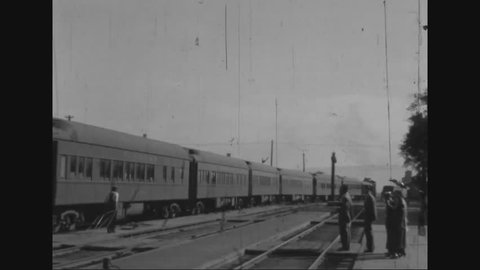 CIRCA 1935 - People board a train and travel to Yellowstone National Park, in Albert Brenos home movies.