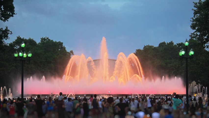 Magic Barcelona fountains, a lot of tourists looking at colorful night show with different water shapes at late evening. Montjuic fontaine, Font màgica de Montjuïc.