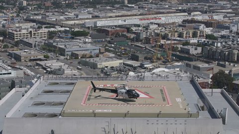Police Helicopter on Rooftop of Federal Building in Los Angeles Downtown USA
