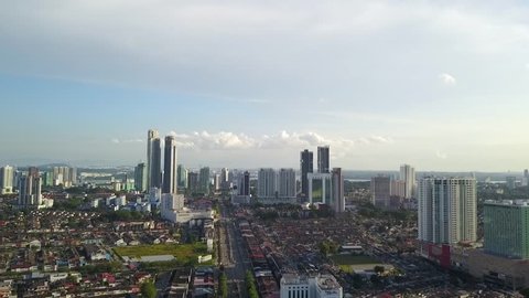 Aerial view of Johor Bahru City with tall buildings in the clear sky afternoon