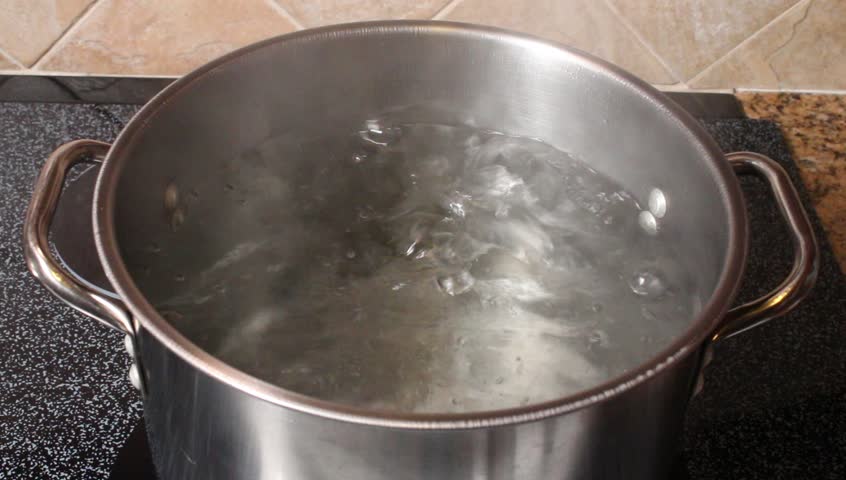 Boiling water in a kitchen pot as a symbol of cooking or food preparation and sterilization of contaminated tap water for healthy pure drinking liquid. | Shutterstock HD Video #3145756