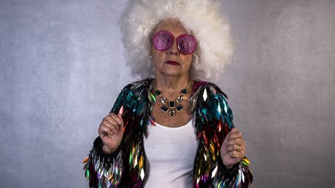 an amazing grandma disco dancer, older lady partying in a disco setting. this version is speeded up to give a more comical effect