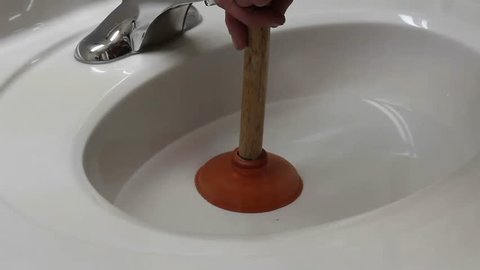 unplugging a sink with a small plunger