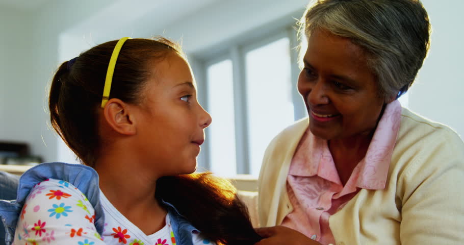 Mixedrace Grandmother Brushing Her Granddaughters Hair Stock Footage