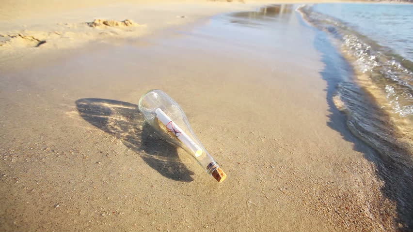 Message in a bottle on sand beach