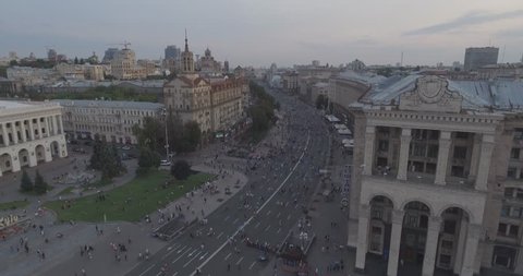 aerial survey. Kiev-Independence Square 25. August 2017. There are crowds of people walking along the central street of Khreschyatik on a wilder day. sunset over the houses.The fountains work people

