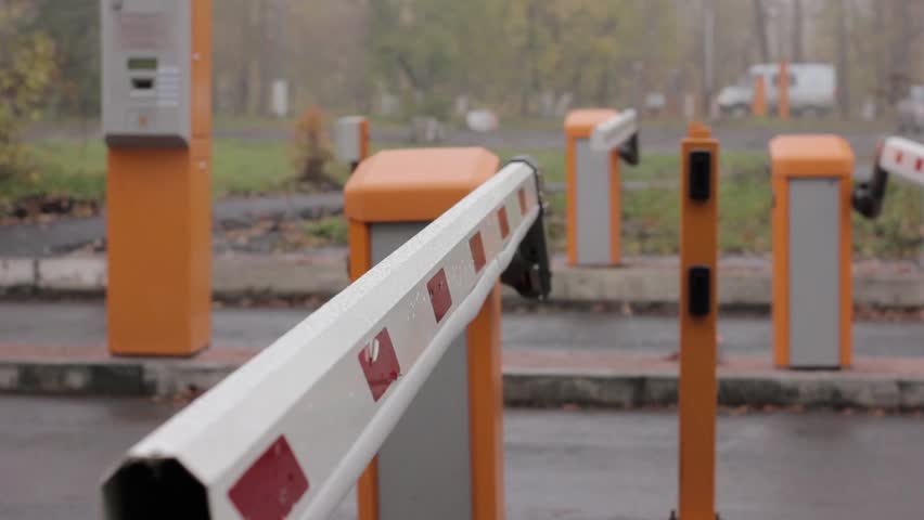 checkpoint three posts. Automatic road barrier gate lifting gate opens and passes car Royalty-Free Stock Footage #31480510