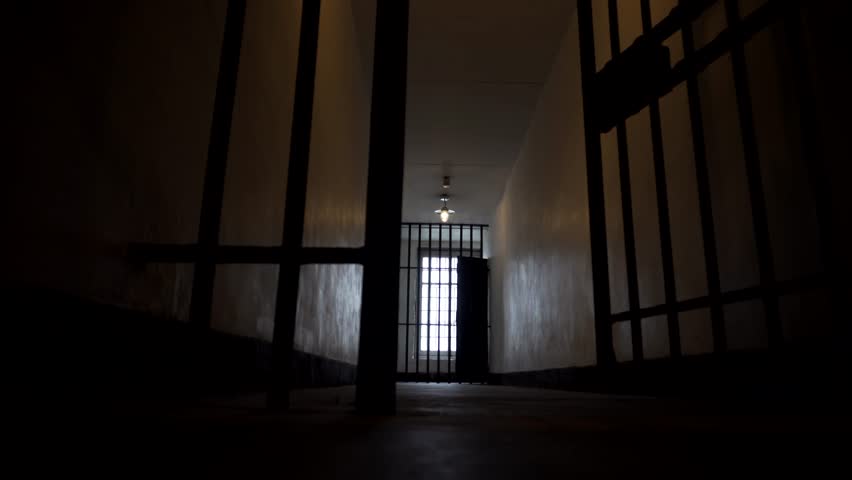 Prison Bars Close Shut in a Dark, Depressing and Lonely Looking Jail in 4K. Secure Penitentiary Cell. Royalty-Free Stock Footage #31485139