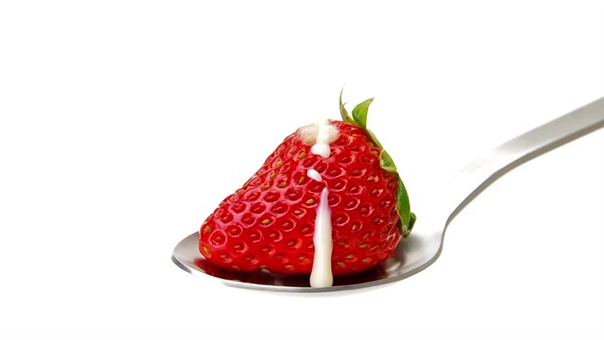 Pouring Condensed Milk on the Strawberry