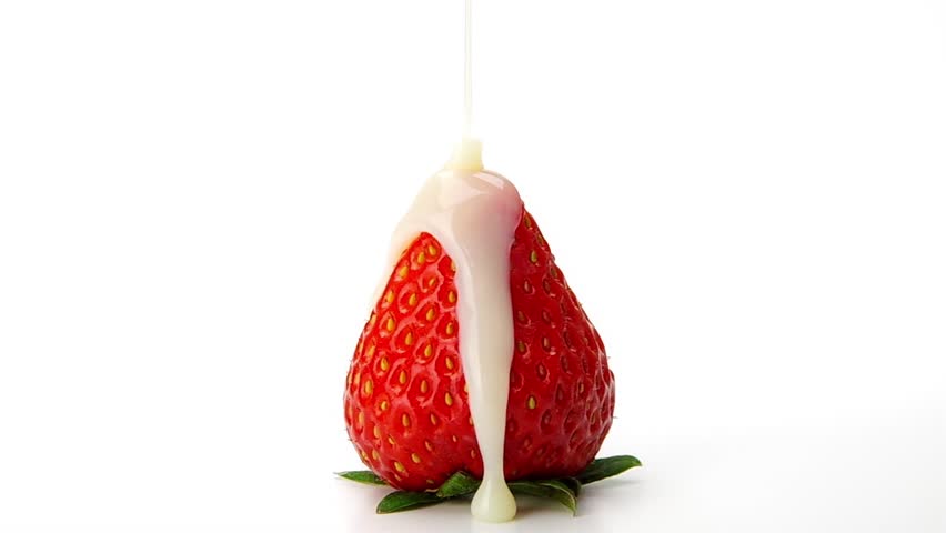 Pouring Condensed Milk on the Strawberry