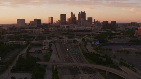 Atlanta, Georgia circa-2017, Flying over freeways approaching downtown Atlanta at sunset. Shot with Cineflex and RED Epic-W Helium.