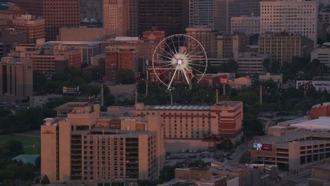 Atlanta, Georgia circa-2017, Aerial shot of ferris wheel in downtown Atlanta at sunset. Shot with Cineflex and RED Epic-W Helium.