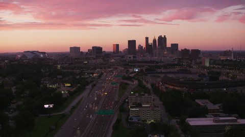 Atlanta, Georgia circa-2017, Flying over freeways leading to downtown Atlanta at sunset. Shot with Cineflex and RED Epic-W Helium.