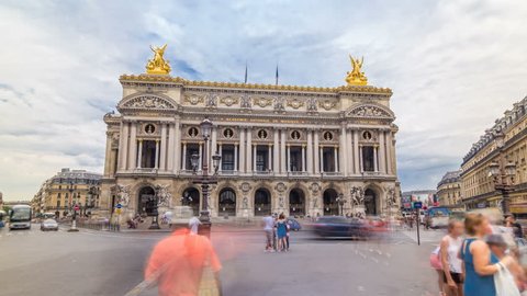 Palais or Opera Garnier The National Academy of Music timelapse hyperlapse in Paris, France. People walking around and traffic on the street. It is a 1979-seat opera house, which was built from 1861