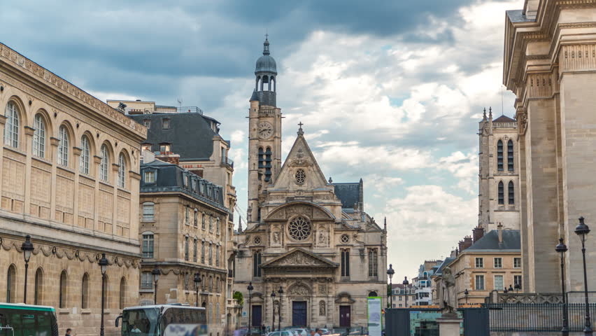 Church of Saint-Etienne-du-Mont timelapse in Paris near Pantheon. It contains shrine of St. Genevieve - patron saint of Paris. Church also contains tombs of Blaise Pascal Jean Racine. Cloudy sky at