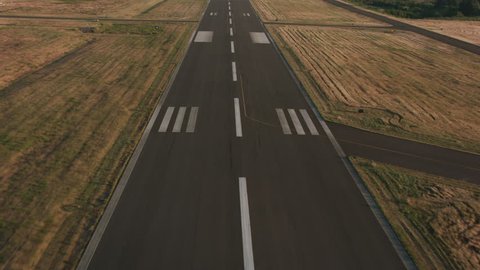 Landing on airport runway. Shot with Cineflex and RED Epic-W Helium.