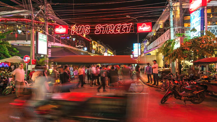 SIEM REAP, CAMBODIA-DECEMBER 9, 2012: Timelapse view of tourists walking in Siem