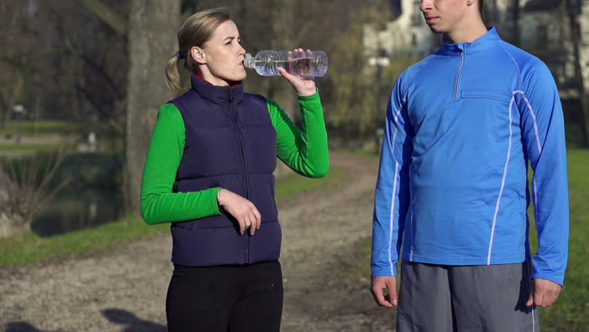 joggers-drinking-water-after-workout-slow-stock-footage-video-100