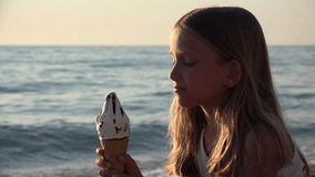 Child Eating Ice Cream on Beach at Sunset, Little Girl on Seashore in Summer 4K