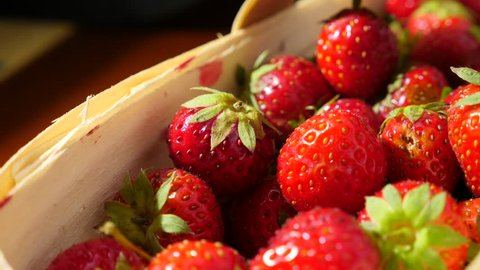 Wicker basket with strawberry on the table, close-up 4k, dolly movement Stock Video