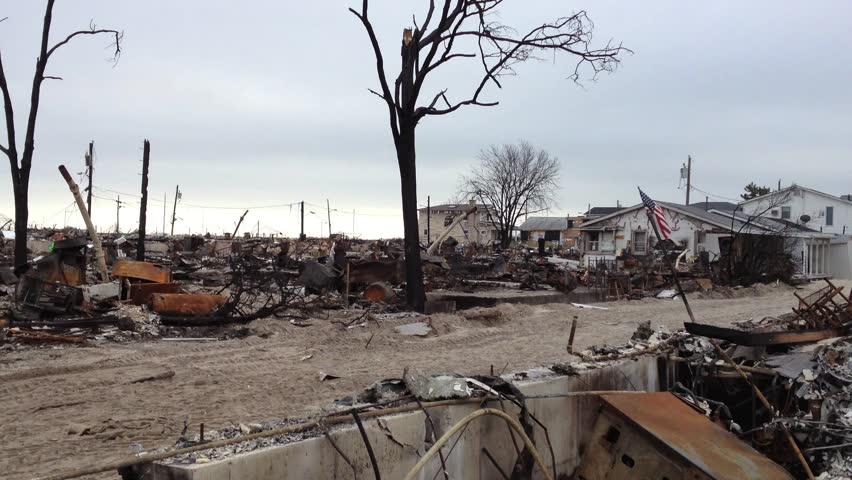BREEZY POINT, QUEENS, NY - December 2, 2012: Video clip of people carrying boxes and recoverable items from wreckage and debris.  111 homes were destroyed by devastating fire during Hurricane Sandy.