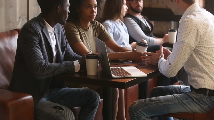 African couple holding meeting with lawyer sitting at coffee house table, black man and woman make agreement handshaking advisor, diverse young business people closing deal after negotiations in cafe Royalty-Free Stock Footage #31517830