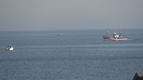 Fishing boat passing on the sea in Golf del Sur Tenerife Spain