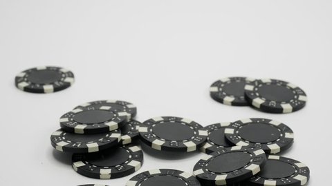 Betting Black Clips at Poker Table Isolated on White Falling