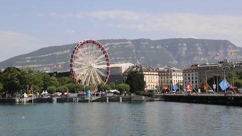 GENEVA, SWITZERLAND - JULY 25, 2017: Ferris wheel in Geneva in a beautiful summer day, Switzerland