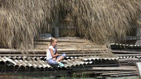 Child Relaxing Outdoor in Nature at Countryside, Girl Sitting by Haystack 4K