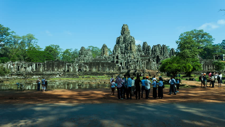 ANGKOR, CAMBODIA-DECEMBER 12, 2012: Timelapse of tourists and elephant in front