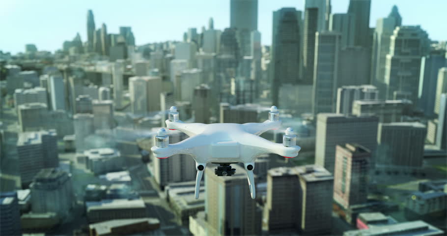 Drone quadrocopter flying above the city on a sunny evening with alpha matte.