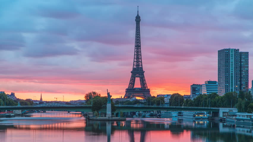 Eiffel Tower sunrise timelapse with boats on Seine river and in Paris, France. View from Mirabeau bridge. Modern buildings and The Statue of Liberty | Shutterstock HD Video #31539466