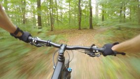 Downhill mountain biking first person point of view on bike trail in summer woods. Forest extreme speed riding, first person perspective view POV. Gimbal stabilized video 4K. - Powered by Shutterstock - Get 15% off with code: PIKWIZARD15