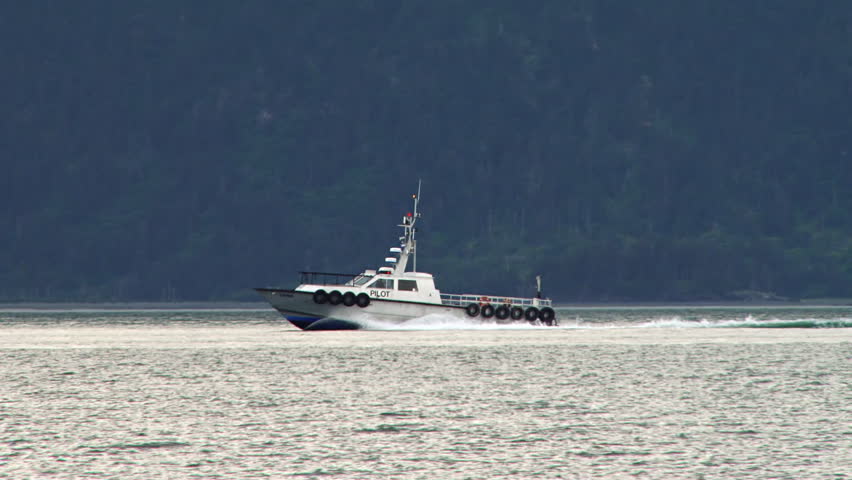 HOMER, AK - CIRCA 2012: Tracking shot of pilot boat returning to harbor under